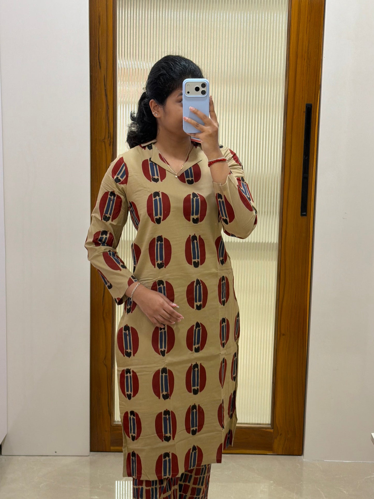 Beige ,red and blue motif kurti only