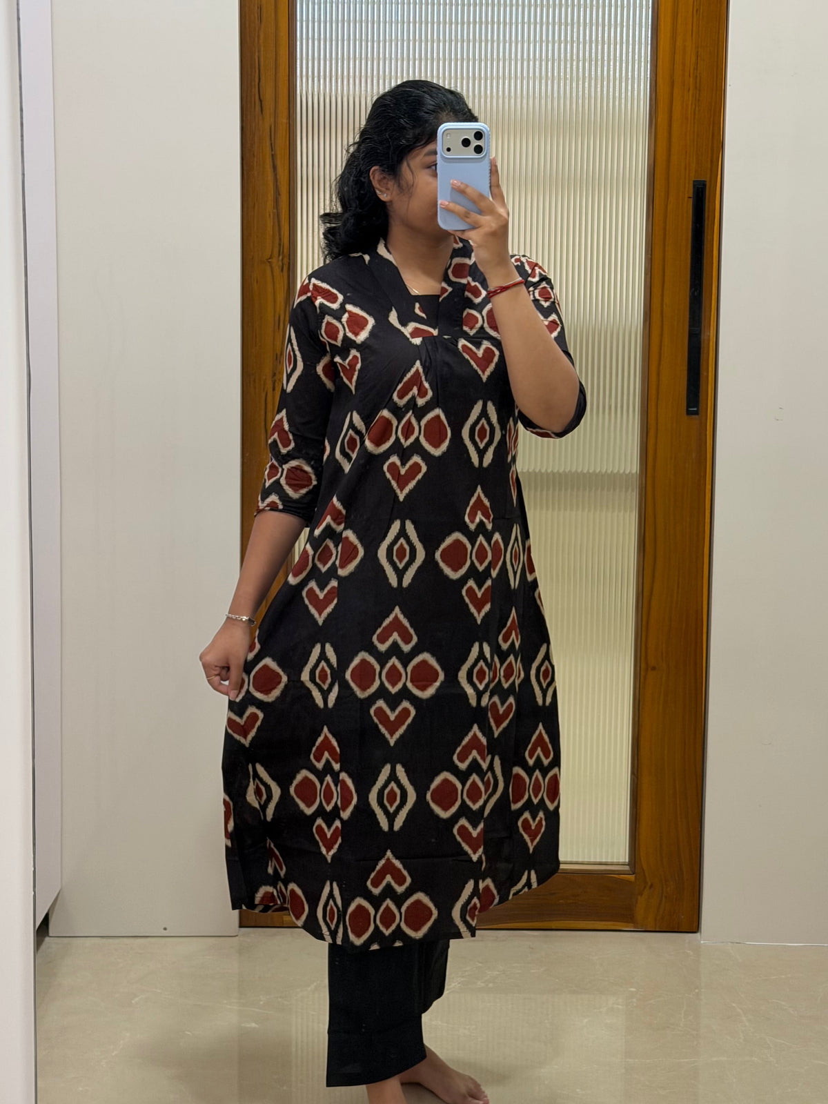 Black and red motif A-line kurti